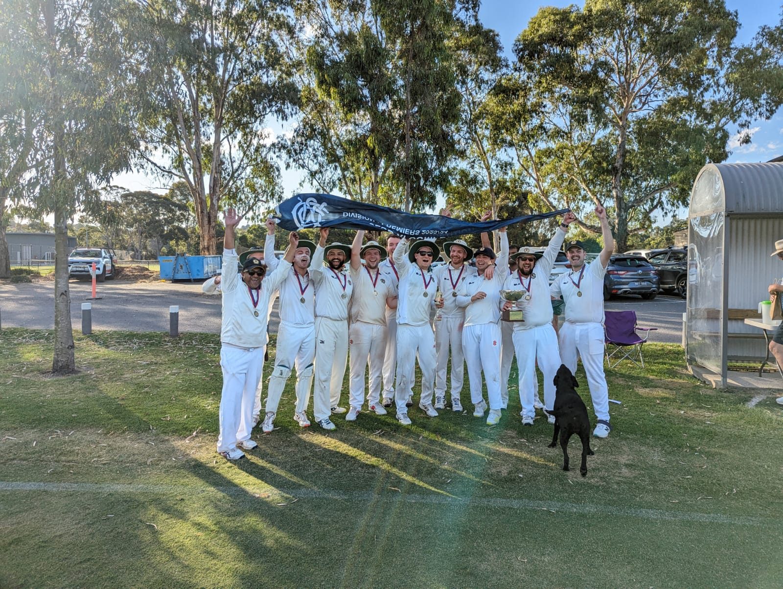 The huddle — plus honorary team dog